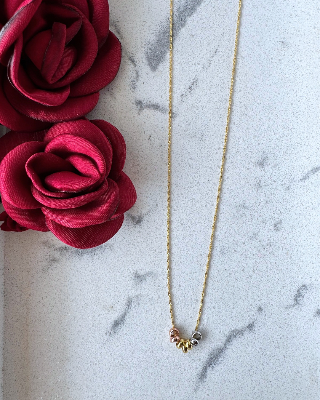 Collier hebdomadaire tricolore en or 10 carats